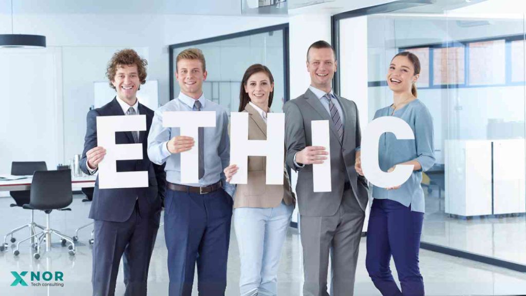Team holding ETHIC letters for XNOR Group’s ethical AI software development