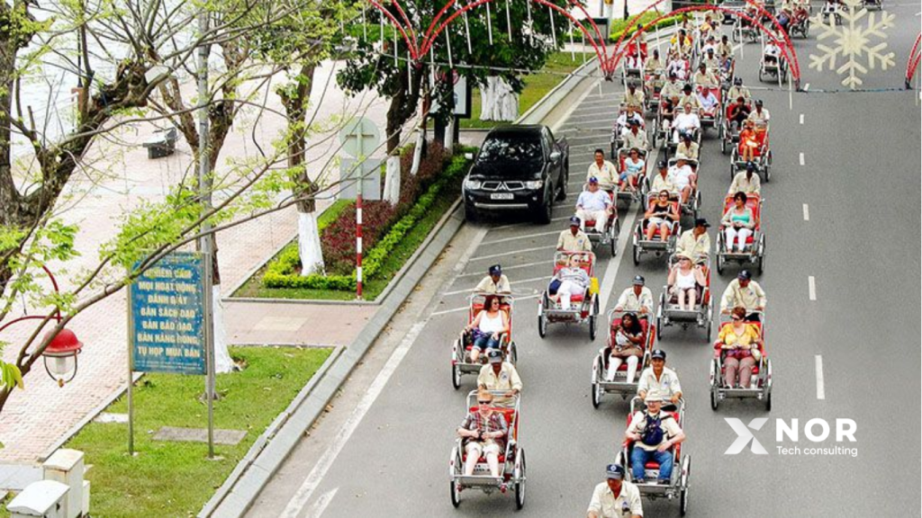 A fleet of cyclos travels along a tourist street in Da Nang, enhanced with AI Voice technology as part of the 'DaNang Cyclo Tours' experience.