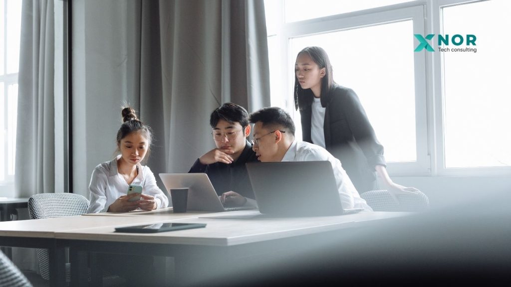 XNOR Group team collaborating on the Blaze Voice AI project.