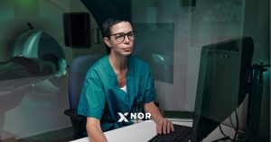 Medical professional using digital healthcare systems to support scalable healthcare innovation and improve clinical workflows.