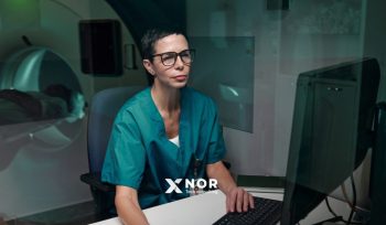 Medical professional using digital healthcare systems to support scalable healthcare innovation and improve clinical workflows.